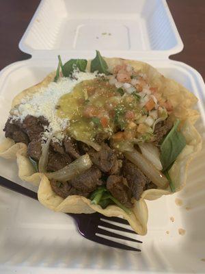 Went back for the taco salad:  Beef, spinach, whole pinto beans (no rice) pico, grilled onions, cotija cheese, green salsa, and guac.