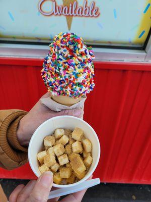 Pistachio Soft Serve w/ rainbow sprinkles + side dish of cheesecake bites.