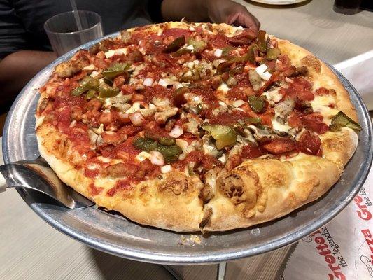 The Baker's Choice has pepperoni, mushrooms, sweet peppers, sausage, onion, garlic, and extra cheese. Ours is without the extra cheese.