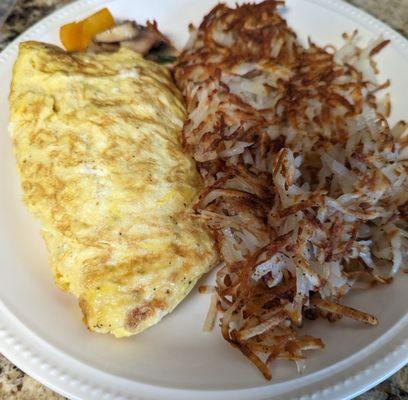 Hubby's, he gets hash browns. His omelette is stuffed with mushrooms,green onions, and bell peppers!