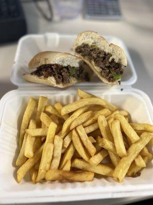 Philly cheesesteak with fries fresh off the grill!