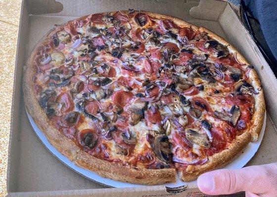 Pepperoni, mushroom, red onion pizza