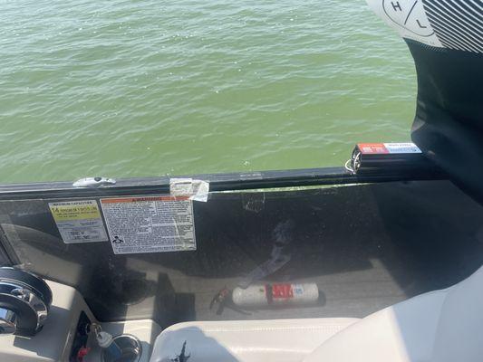 Side of boat held together with packing tape.