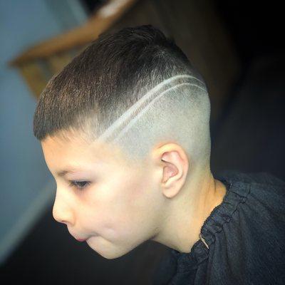 Mid skin fade with design