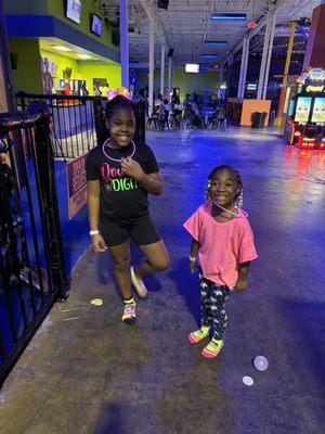 My daughter with her "glow necklace" and socks they provide thats not glowing.