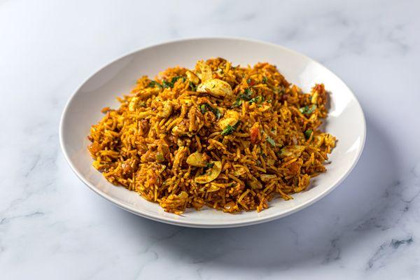 Anda Pulav:
Rice cooked with boiled eggs & Indian spices