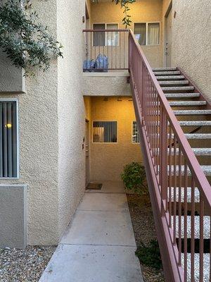 Neighbor upstairs garage outside.