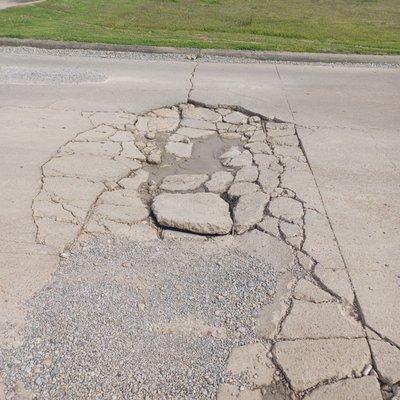 Potholes in front of the Nelco!