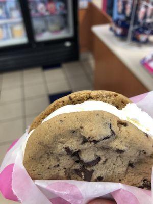 2 fresh delicious chocolate chip cookies with freshly scooped vanilla ice cream