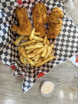 Chicken strips, fries, their sauce