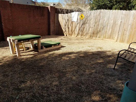 Right side of outdoor space. Rocks but I guess easier to maintain than grass.