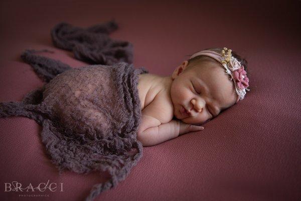 A newborn baby photo session with Sarah Bracci Photographics. Posed newborn babies are best within the first 5 weeks for studio posing.