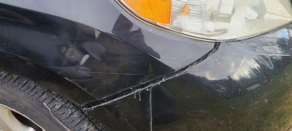 You can see the dent and scratch that led to the bumper being ripped away.