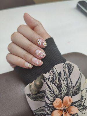 Pink ombre nails with white flowers