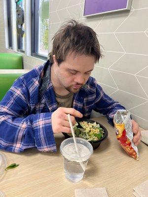 Shawn eating salad