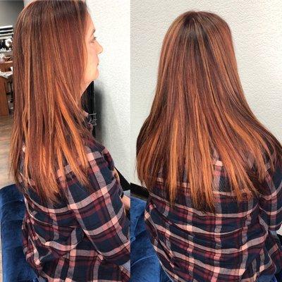 Golden highlights, red all over color, and tape in hair extensions