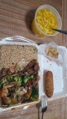 Beef with vegetables lunch with egg drop soup and egg roll