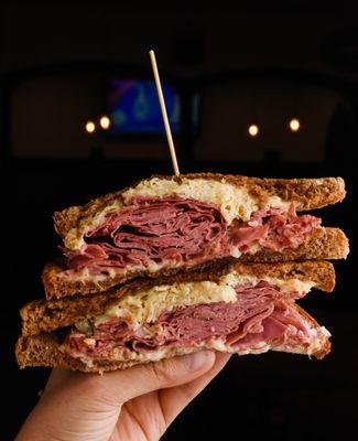 Reuben: Sliced corn beef, sauerkraut, Swiss, Russian dressing, rye bread. All burgers and sandwiches are served with fries.