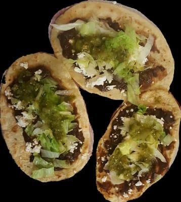 Memelitas, hand made tortillas with black beans, cheese, green salsa.