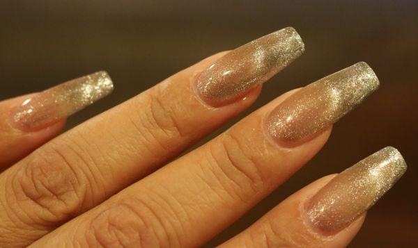 Cat eye with partial shimmery silver French tips. Color changes with the angle of light. Stunning in-person!