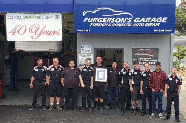 Furgerson's Garage Team picture with AAA National Gold Winner Award plaque.