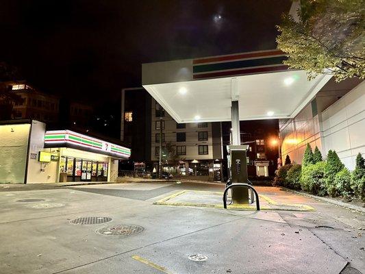 Convenience store and gas pumps at night