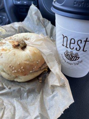 Sausage egg and cheese on a sesame bagel with a latte!