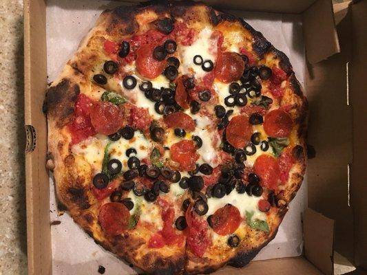 Pizza margherita with pepperoni and olives