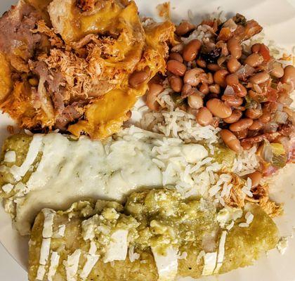 Enchiladas Verdes with a side of nachos, rice and charro beans