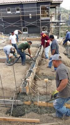 Pouring footings on a house foundation