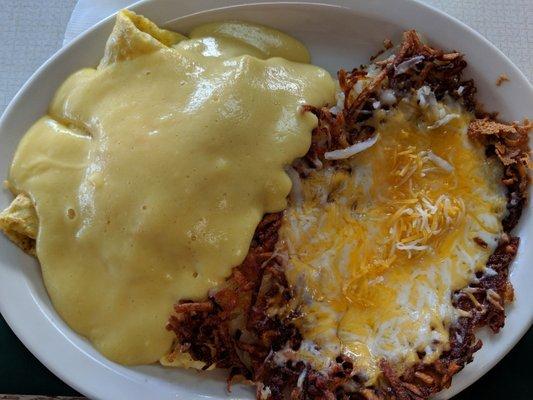 Omelette with hollandaise sauce with side of cheesy hash browns