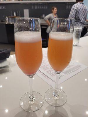 Peach raspberry mimosas