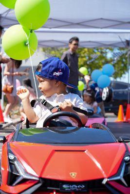 Young dodger fan waving at his mom at a kid's birthday party event