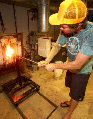 Heating the glass piece.