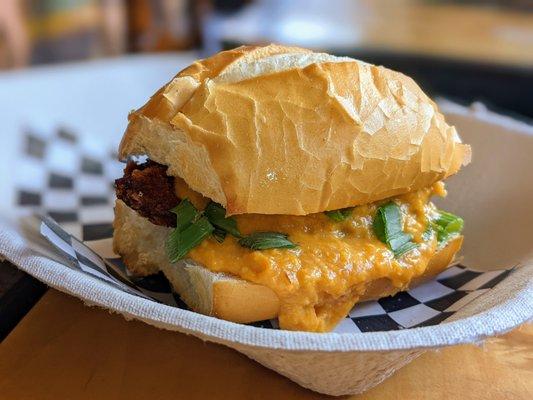 Chicken Milanesa Sandwich. $8. Panko-fried chicken topped w/ mild cream corn sauce and green onions, served on fresh-baked Brazilian bread.