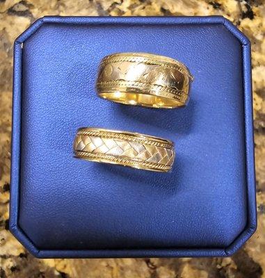 25 year old wedding ring at top and replacement ring for my husband. The first one was wider and I have the matching wedding band.