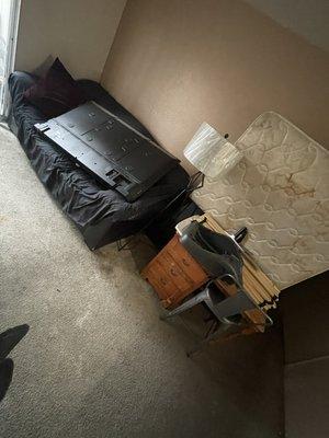 Couch, mattress, desk, tv and miscellaneous items removed from an upstairs apartment in Fresno.