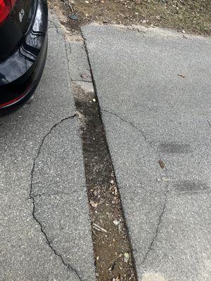 The trench and condition they left their driveway in