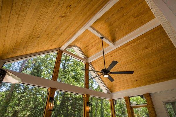 Screened porch with high gable ceiling designed and built by Atlanta Decking & Fence.