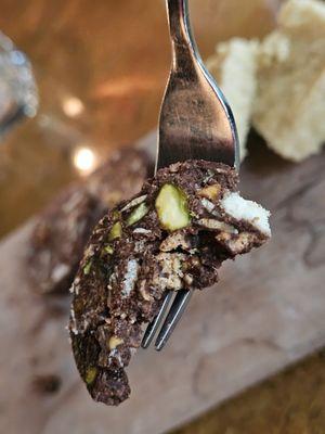 A fork holding a piece of the Salame di Cioccolato.