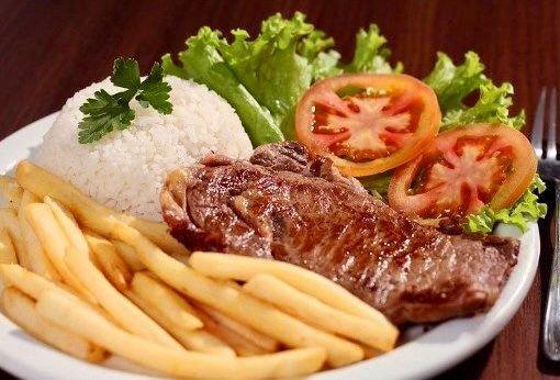 GRILLED STEAK OR CHICKEN,CALABREZA ,TILAPIA, OU PORK SERVED WITH WHITE JASMIN RICE ,BEANS FRESH FRIES , SIDE SALAD GREEN LEAF TOMATOES ONION