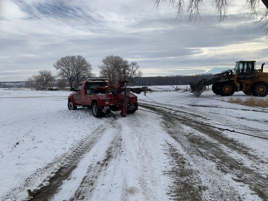 winch and chains hard at work, wrecker placed on stable ground