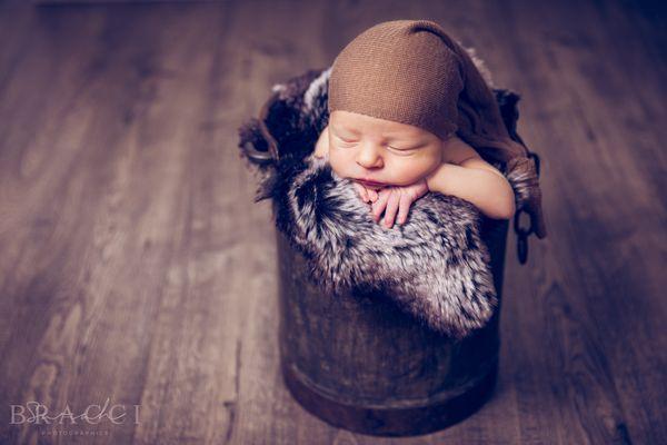 A newborn baby photo session with Sarah Bracci Photographics. Posed newborn babies are best within the first 5 weeks for studio posing.