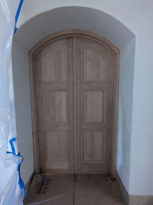 Custom pair of Arched Clear Alder doors for Master Bathroom for a Traditional European look