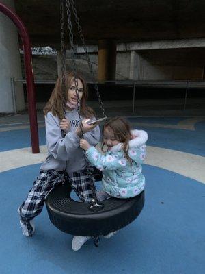 My girls on the tire swing.