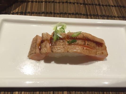 Salmon Toro. Medium cut, not super oily but super delicious none the less. Torched and topped with scallion