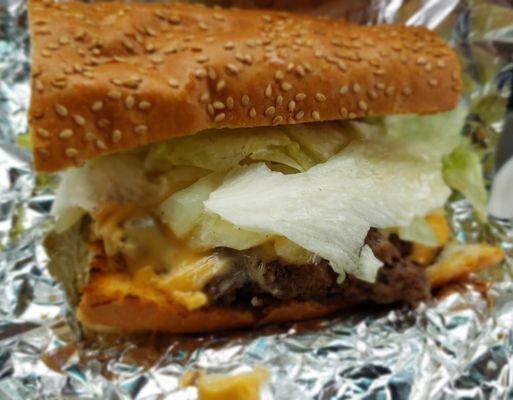 The cheeseburger on sesame seed French bread