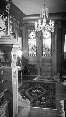 Inside double stained-glass & oak front doors.