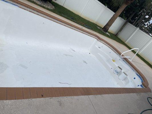 The shallow end of my pool that's "done" but it's gritty, not smooth, uneven, filthy, horrible quality.