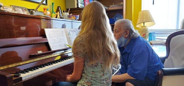 Irwin teaching a 13 yr old piano.